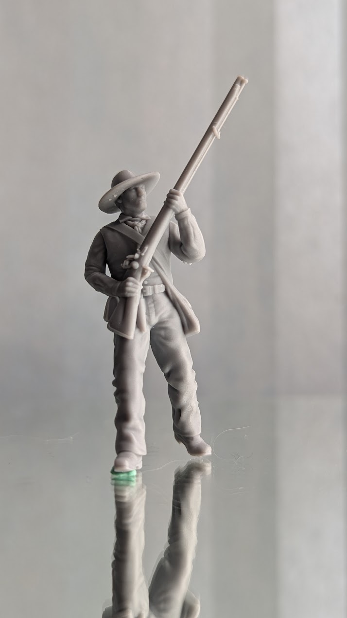 Alamo Volunteer standing with musket