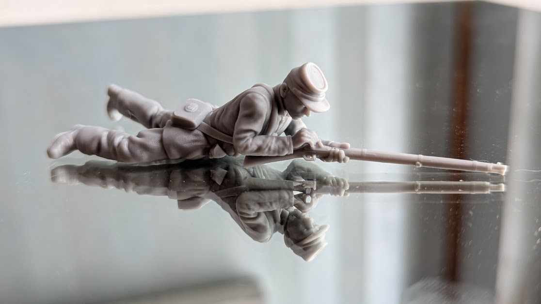 Union soldier on ground loading rifle