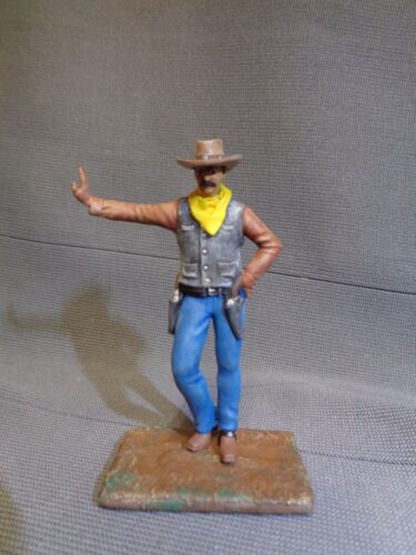 Click to view full screen Cowboy leaning hand on wall photo review