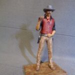 Cowboy with rifle over shoulder photo review
