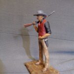 Cowboy with rifle over shoulder photo review