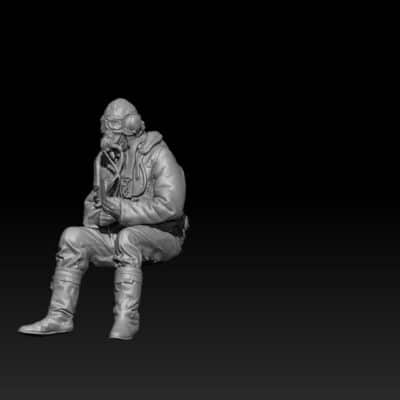 British WW2 pilot sitting in airplane